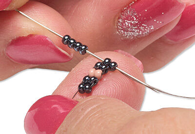 Beads threaded with a needle